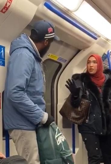A woman in a hijab defending the Jewish family who was being harassed