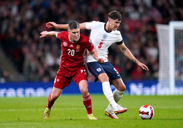 Goalscorers John Stones, right, and Roland Sallai battle for the ball