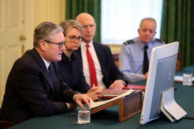 Sir Keir Starmer, sitting next to Yvette Cooper, John Healey and the Chief of the Defence Staff, addresses a virtual meeting of the coalition of the willing from the Cabinet Room at 10 Downing Street