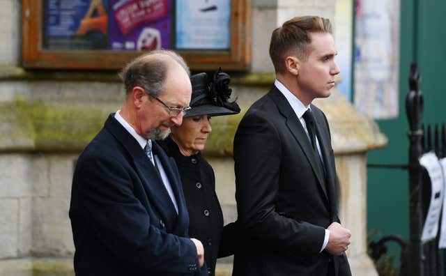 Jane Hawking, the first wife of Professor Stephen Hawking and their son Timothy (right), leave following his funeral at University Church of St Mary the Great in Cambridge