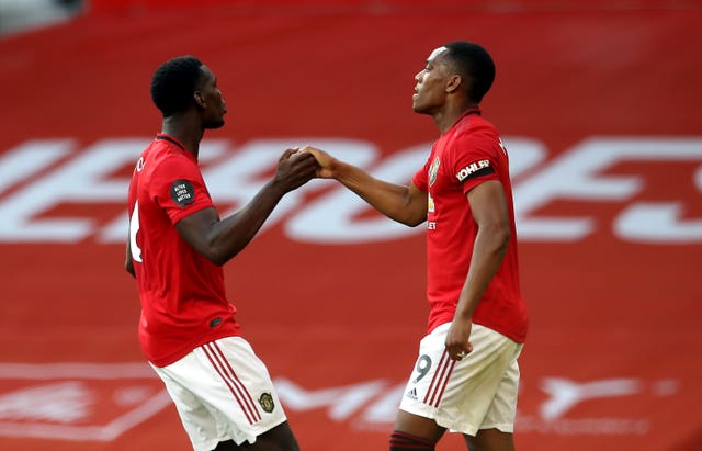 Martial celebrates scoring his third goal with Paul Pogba, left 