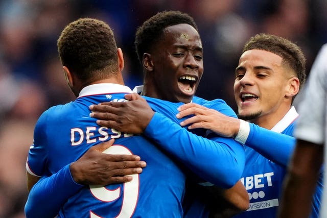 Rangers’ Djeidi Gassama, centre, celebrates his first goal with Cyriel Dessers, left