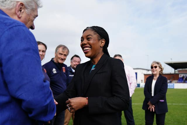 Kemi Badenoch meets staff at a football ground on the campaign trail