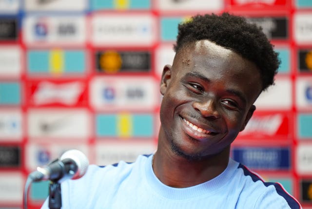 Bukayo Saka speaks to the media