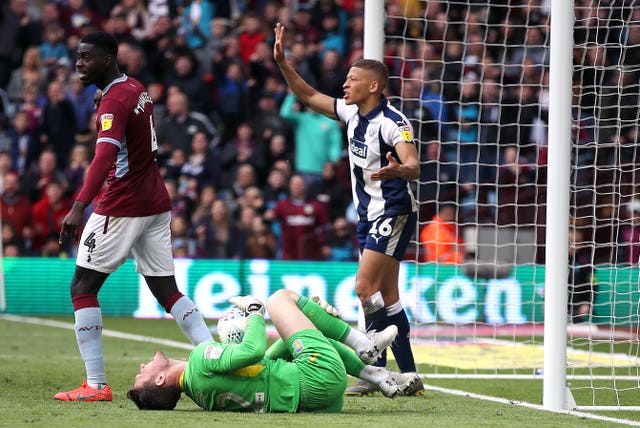 Dwight Gayle seconds before he is controversially shown a second yellow card during West Brom's 2-1 defeat at Aston Villa