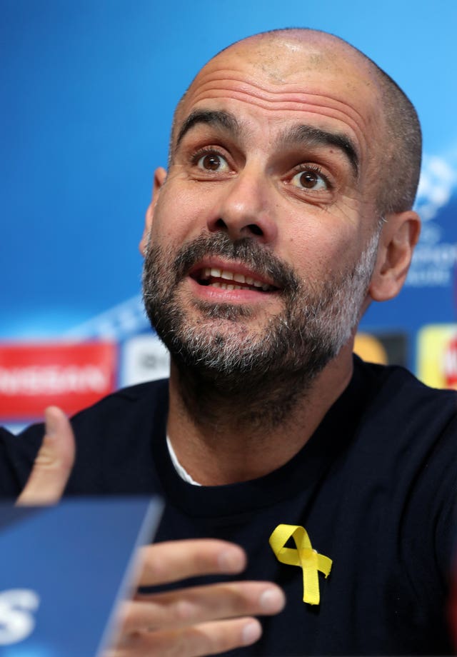 Pep Guardiola with a yellow ribbon