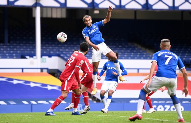 Dominic Calvert-Lewin, centre, wins a header against Liverpool