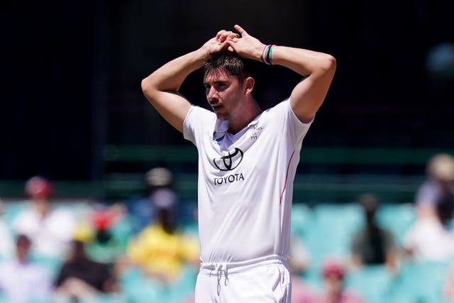 Josh Tongue puts his hands on his head