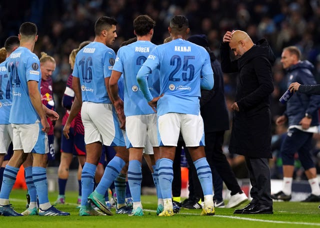 Pep Guardiola, right, talks to his players during Manchester City''s win over RB Leipzig