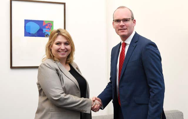 Irish Foreign Affairs Minister Simon Coveney shakes hands with Northern Ireland Secretary Karen Bradley at the Northern Ireland Office in Westminster, London (Stefan Rousseau/PA)