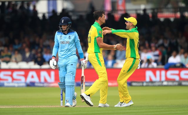 Mitchell Starc celebrates trapping Joe Root lbw