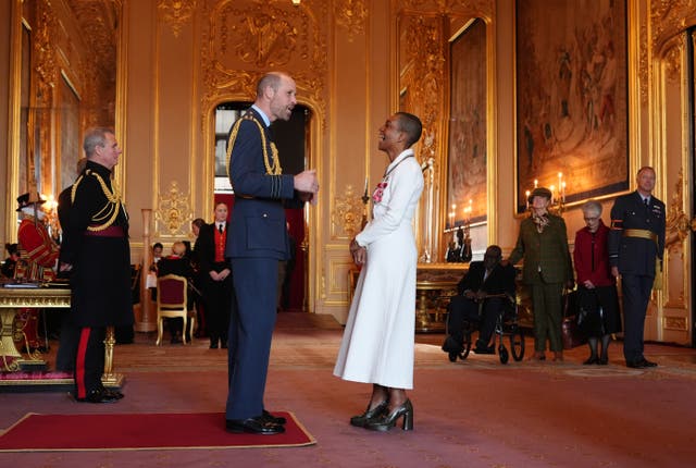The actress is made an MBE by the Prince of Wales