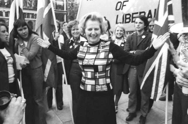 Margaret Thatcher, sporting a sweater bearing the flags of European nations, in Parliament Square during her ‘Yes to Europe’ campaign (PA)