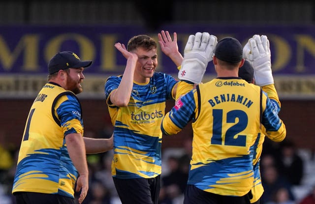 Birmingham Bears' Henry Brooks (centre) celebrates the wicket of Luis Reece