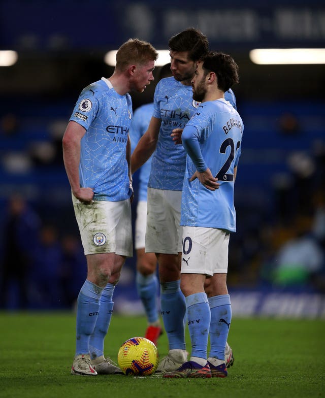 Manchester City's Kevin De Bruyne (left), Ruben Dias and Bernardo Silva (right) will be the best of enemies on international duty