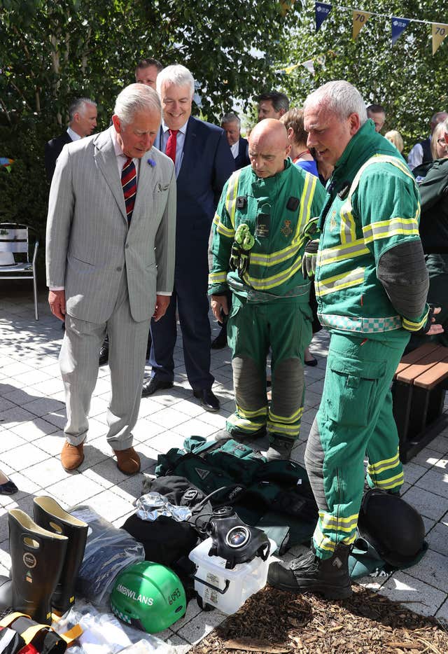 Charles meets an ambulance crew on the fourth day of his tour of Wales