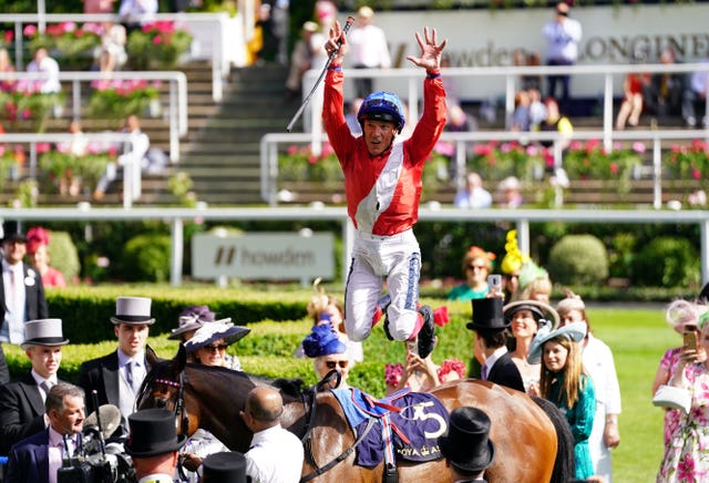 Frankie Dettori performs his trademark flying dismount after steering Inspiral to victory
