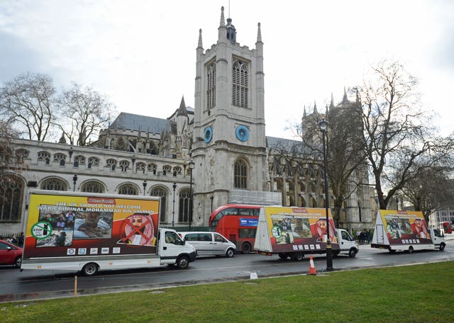Three billboards protesting against the visit are driven around Parliament Square (Kirsty O’Connor/PA)