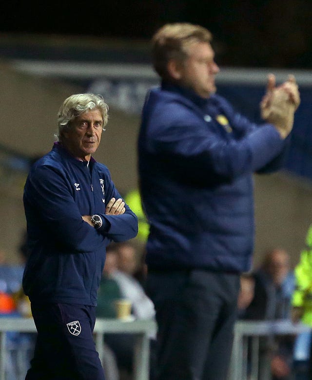 Manuel Pellegrini, left, and Oxford manager Karl Robinson