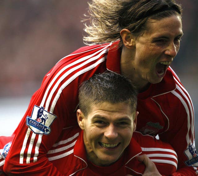 Fernando Torres, top, congratulates Steven Gerrard on a goal against Newcastle