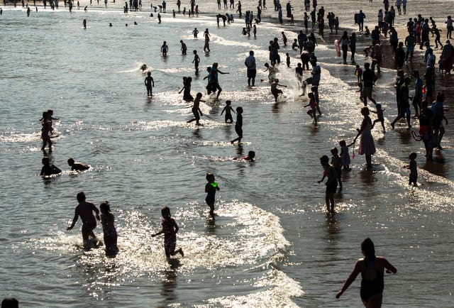 The hot weather experienced in places like Scarborough Beach last weekend will make way to chillier conditions (Danny Lawson/PA)