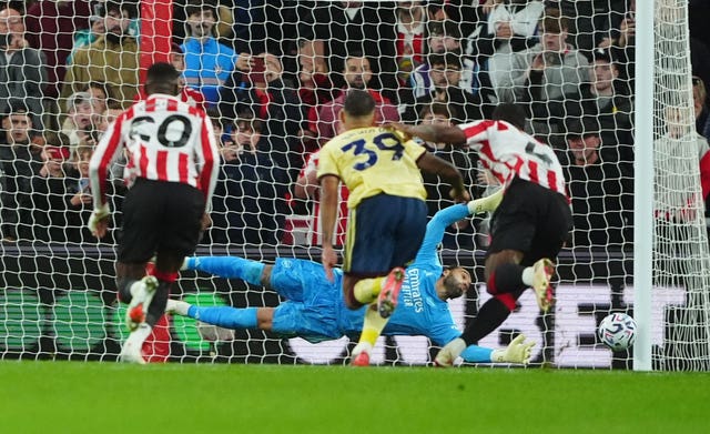 Arsenal goalkeeper David Raya saves a penalty