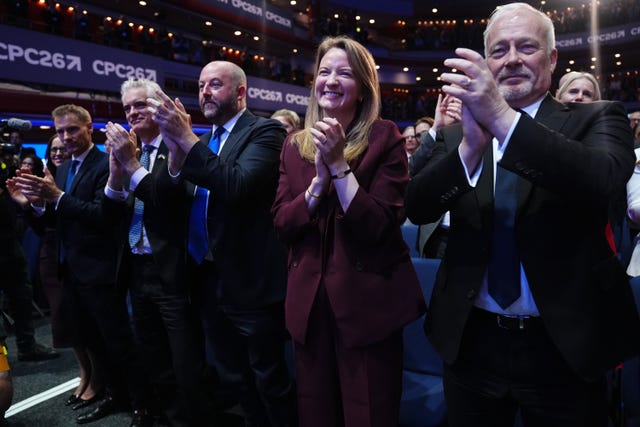 Members of the shadow cabinet standing and clapping