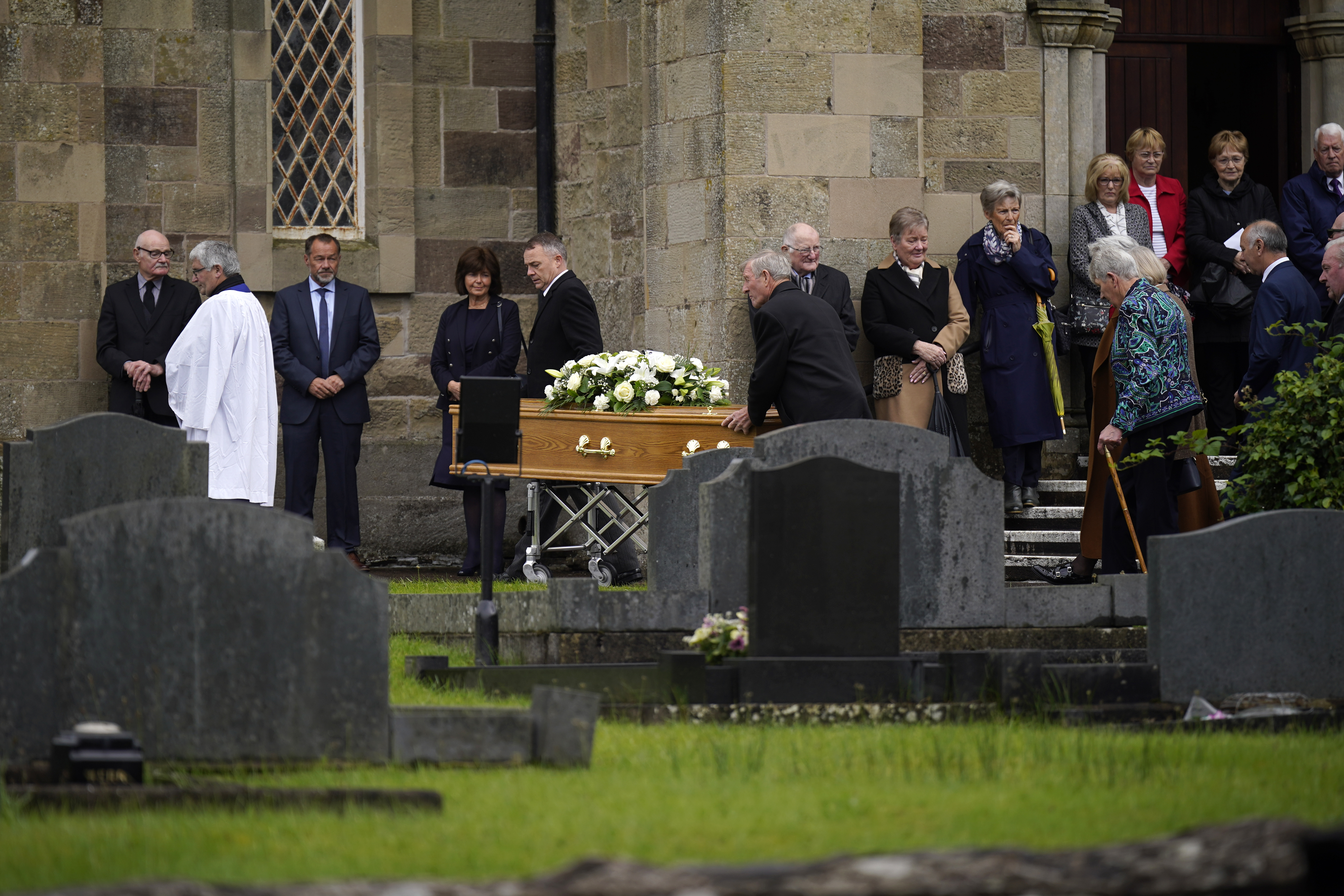 The coffin of country music star Derrick Mehaffey is taken to the graveyard at Donacavey Church of Ireland Parish Church
