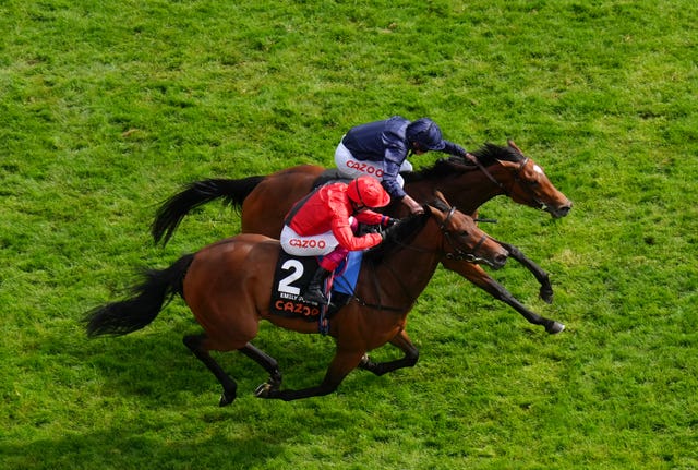 Emily Upjohn (red) was touched off in the Oaks by Tuesday