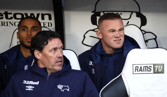Wayne Rooney was in the dugout for the first time at derby ahead of his player-coach role 