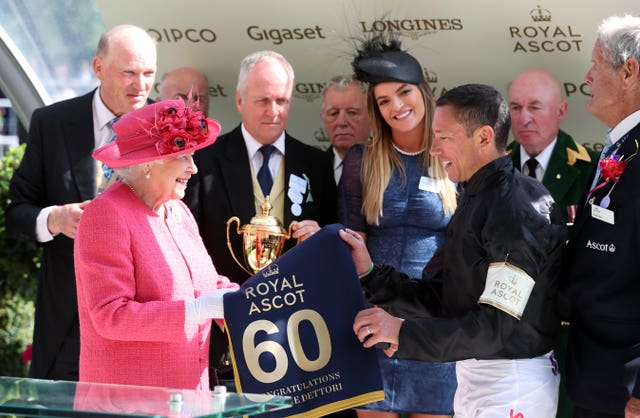 The Queen presented Dettori with a special memento for his 60th Royal Ascot win after last year's Gold Cup