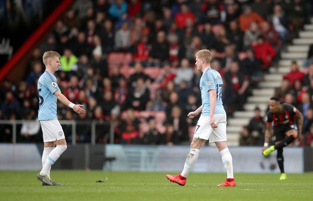Kevin De Bruyne, right, leaves the pitch after picking up an injury 