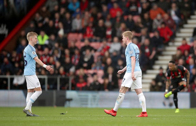 Kevin De Bruyne, right, leaves the pitch after picking up an injury