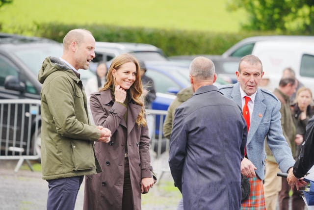 William and Kate chatting to a group of people outside