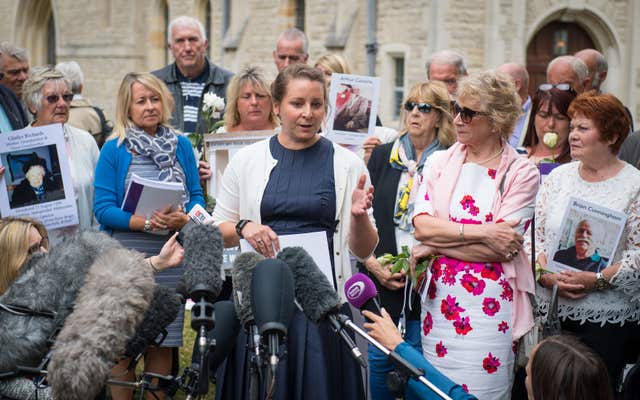 Bridget Reeves (centre), the granddaugher of Elsie Devine who died at Gosport War Memorial Hospital, and her mother Ann (second from right) speak to the media after the disclosure of the Gosport Independent Panel’s report