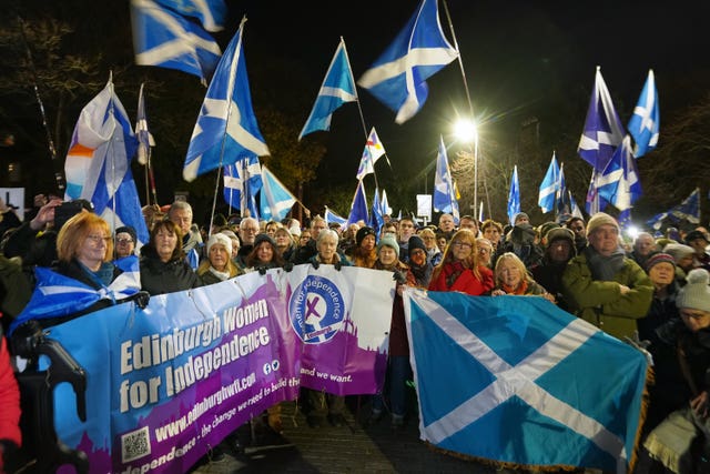 People attend a rally outside the Scottish Parliament in Edinburgh following the UK Supreme Court decision