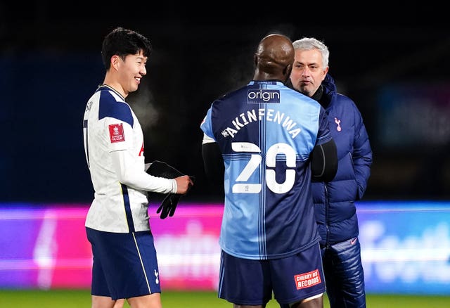 Jose Mourinho, right, talks to Wycombe''s Adebayo Akinfenwa