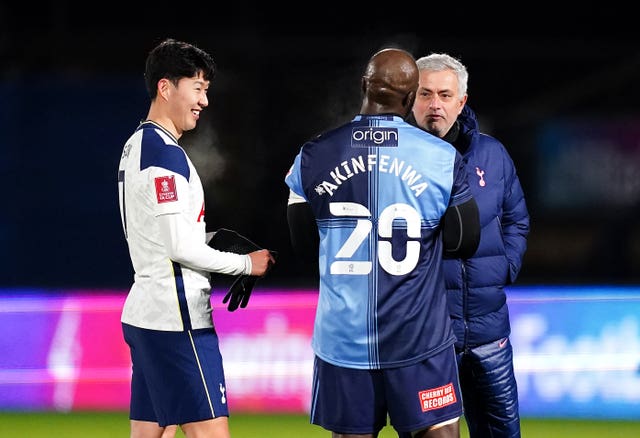 Jose Mourinho, right, talks to Wycombe''s Adebayo Akinfenwa