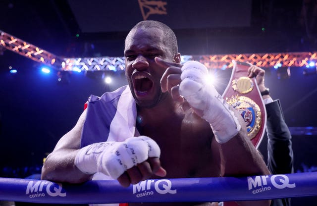 Daniel Dubois celebrates winning the WBO heavyweight title