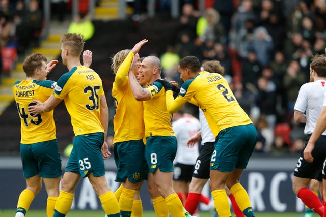 A much-changed Celtic side overcame the elements to secure a William Hill Scottish Cup quarter-final place with a 3-0 win over Clyde at Broadwood