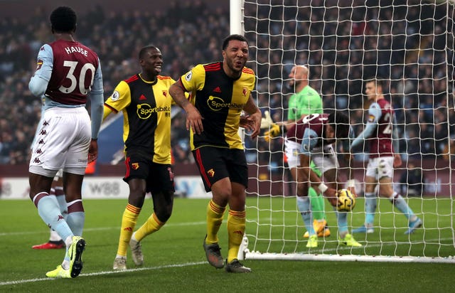 Troy Deeney, right, celebrates his opener