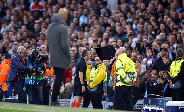 Guardiola looks on as Cuneyt Cakir checks the video