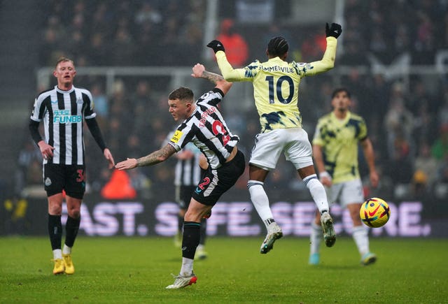 Kieran Trippier and and Crysencio Summerville battle for the ball