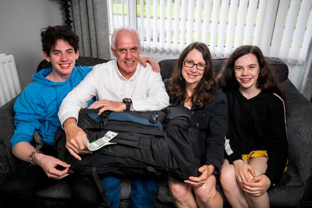 Bob Gilmour and family with the bag that was returned after it had gone missing for several days on an Aer Lingus flight from Milan to Dublin