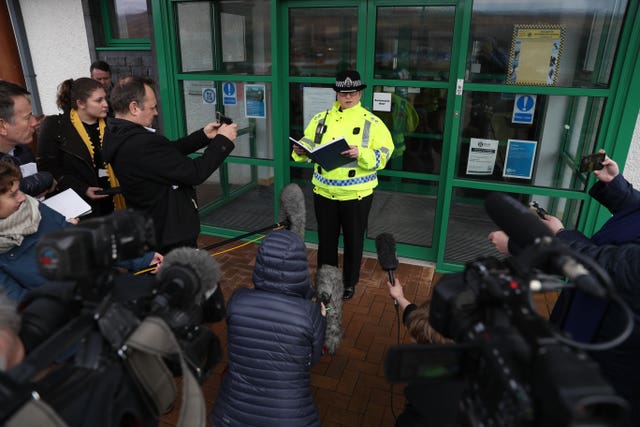 A police officer talks to media following a fatal avalanche