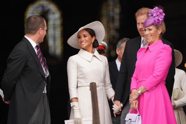 Meghan spoke to Harry's cousins Peter Phillips and Zara Tindall as they left the service