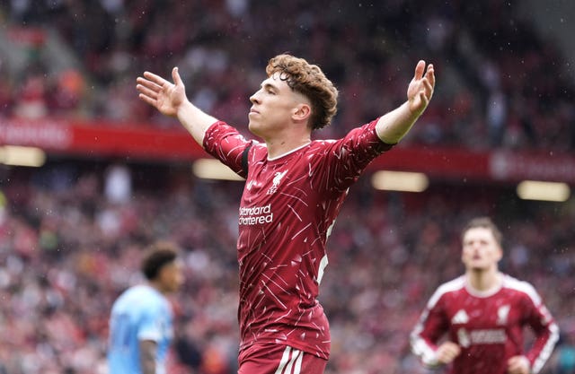 Liverpool’s Victor Munoz stretches his arms to celebrate scoring a goal