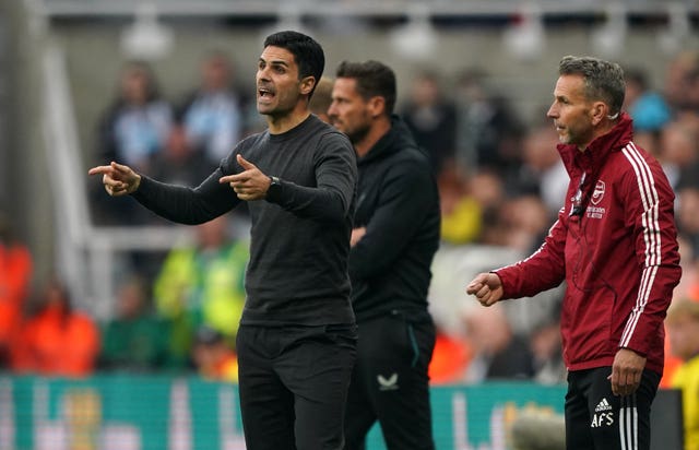 Mikel Arteta (left) on the touchline