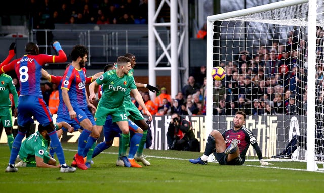 Craig Cathcart, centre, scores an own goal