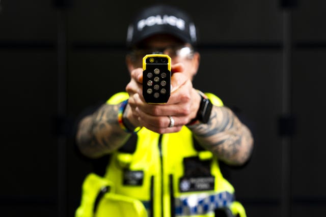 An officer during a demonstration of the Taser 10